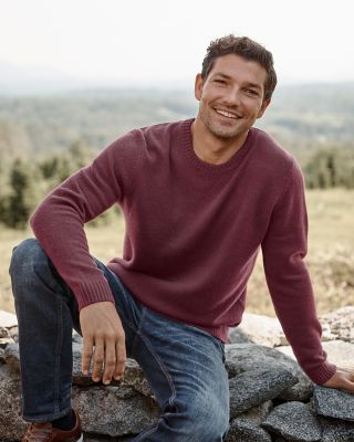 A man in a blue and gray striped Washable-Cashmere sweatshirt. Visit the Men's Shop.