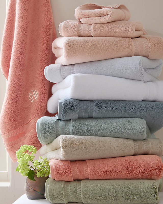 A stack of our Cloud-Loft towels in various colors. Shop all bath.