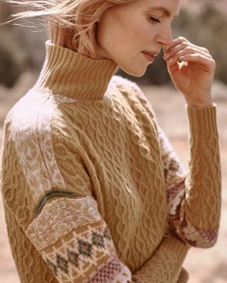 A woman in a Recycled-Cashmere sweater with a cashmere hat and mittens. Shop women's cashmere.