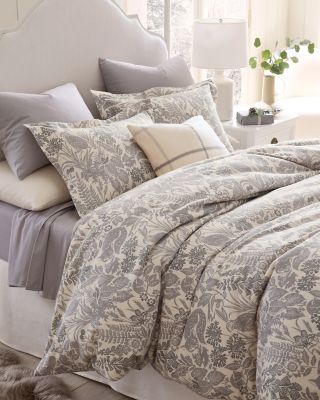 A bed with floral organic-cotton flannel bedding. Browse the flannel shop.